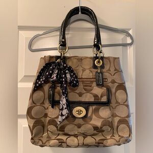 Coach purse. Large brown coach print.